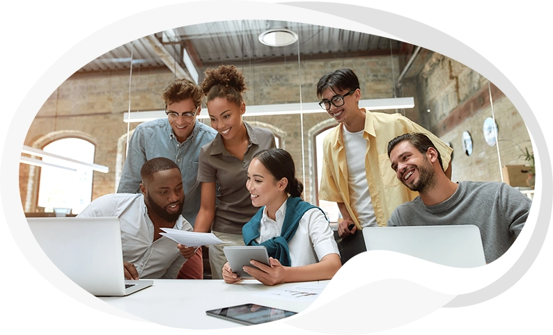 Image of six business people working together at one desk