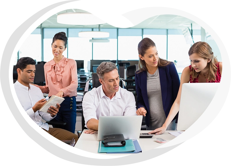 Image of five people working in an office